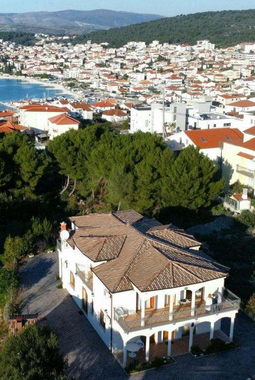 an aerial view of a large white house with a city at New Villa Dubai - Okrug Gornji,Trogir, Hrvatska in Trogir
