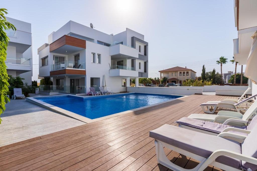 a swimming pool in the backyard of a house at Valleria - 2 BR Apartment W Pool in Larnaca in Larnaka