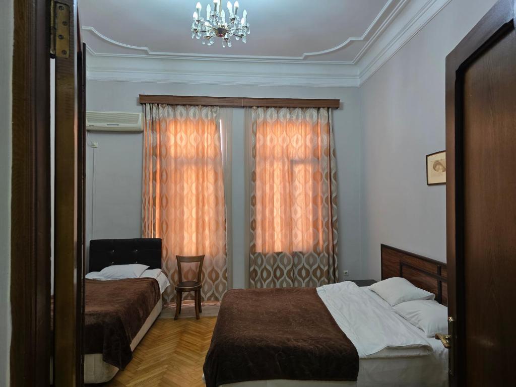 Postel nebo postele na pokoji v ubytování CATTALEYA
