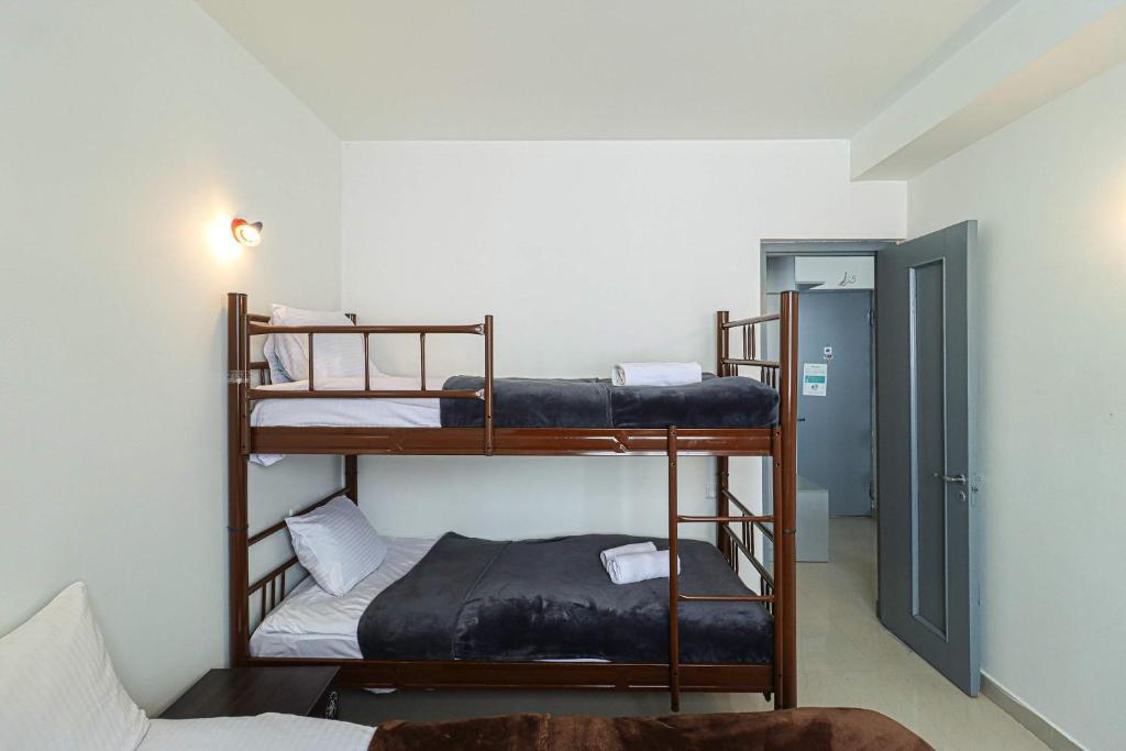 a room with three bunk beds in a room at 1BR Apartment in Gudauri in Gudauri