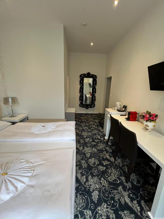 Postel nebo postele na pokoji v ubytování Hotel Gasteiner Hof