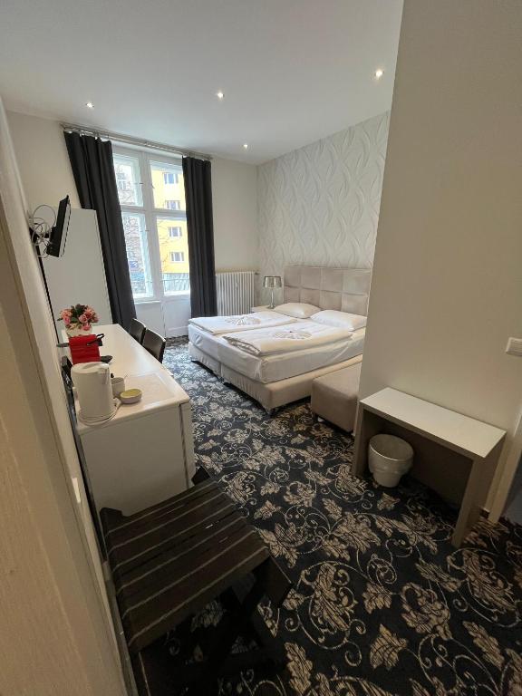 Postel nebo postele na pokoji v ubytování Hotel Gasteiner Hof