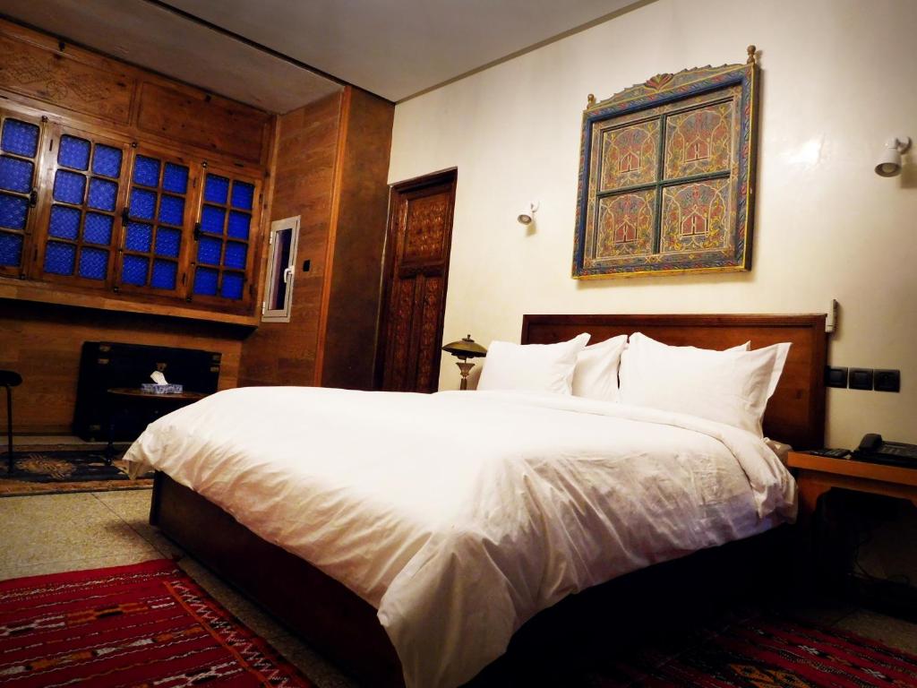Postel nebo postele na pokoji v ubytování Hotel des Oudaias