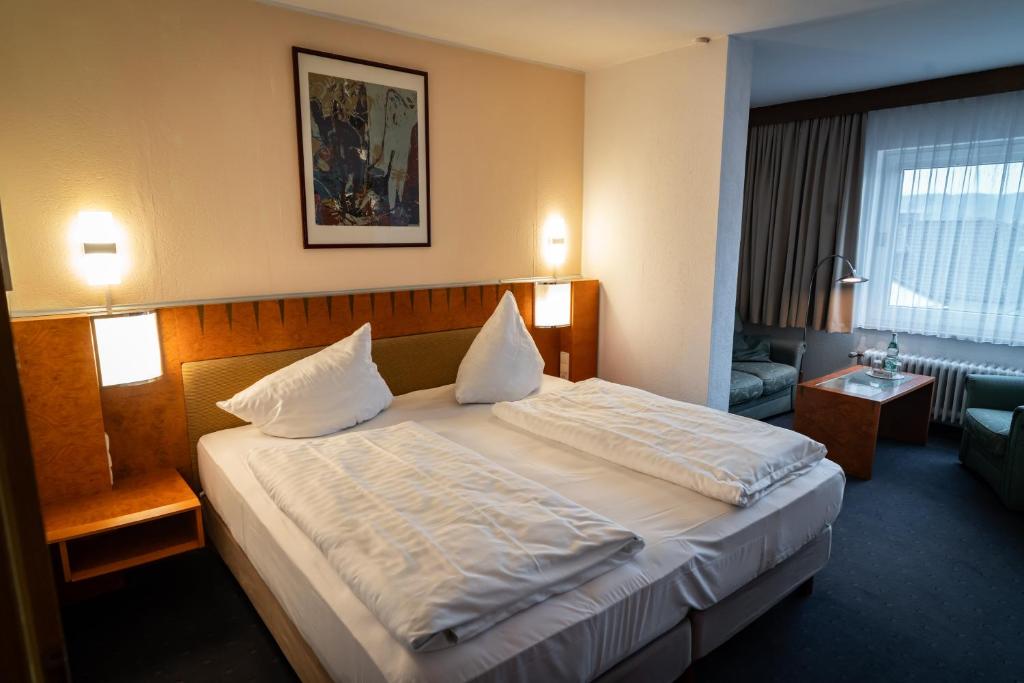 Postel nebo postele na pokoji v ubytování Hotel Martina