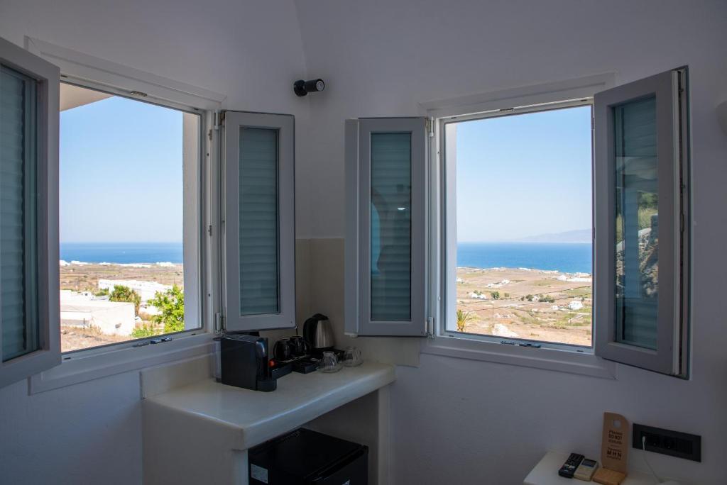 Kuchyň nebo kuchyňský kout v ubytování White Cave Villas