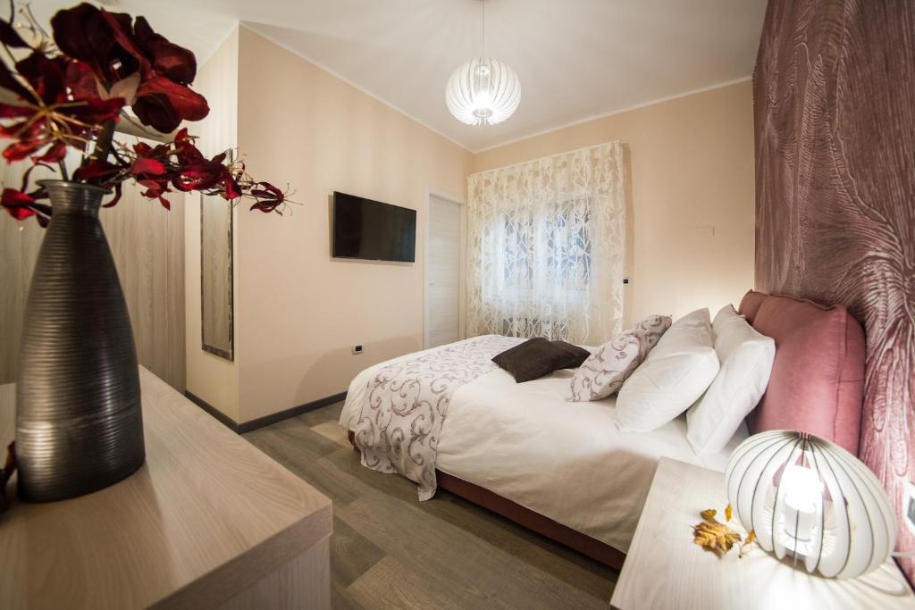 Postel nebo postele na pokoji v ubytování Aiem B&B