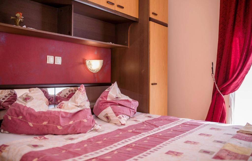 Postel nebo postele na pokoji v ubytování Apartments Gordana