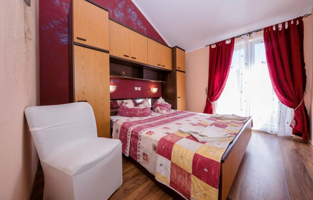 Postel nebo postele na pokoji v ubytování Apartments Gordana
