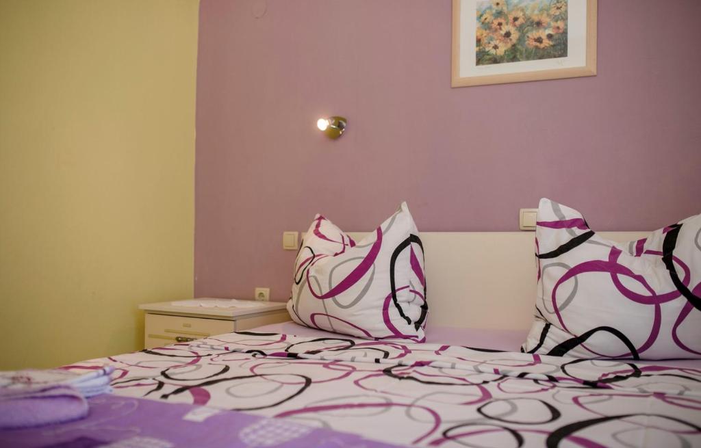Postel nebo postele na pokoji v ubytování Apartments Gordana