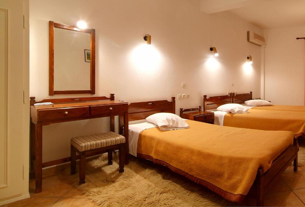 Postel nebo postele na pokoji v ubytování Hotel Orfeas