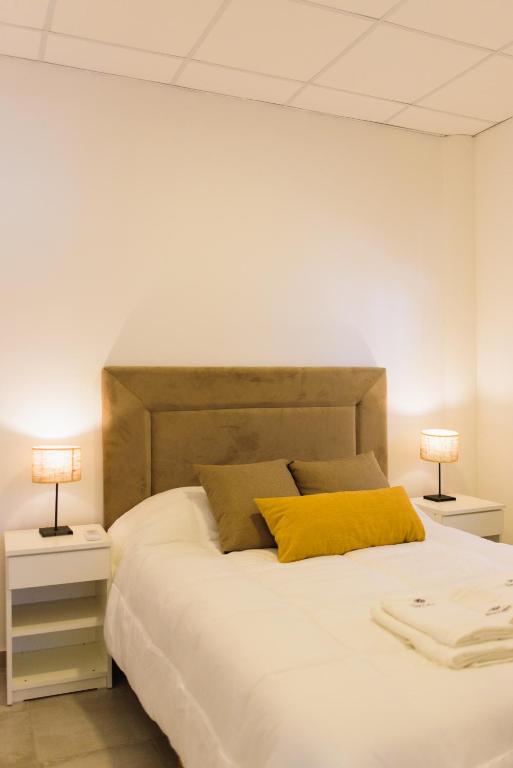 Postel nebo postele na pokoji v ubytování Don Pedro Apart Hotel