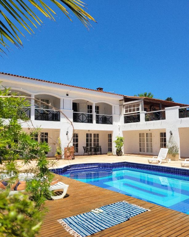 an image of a house with a swimming pool at Resort La Marina in Búzios