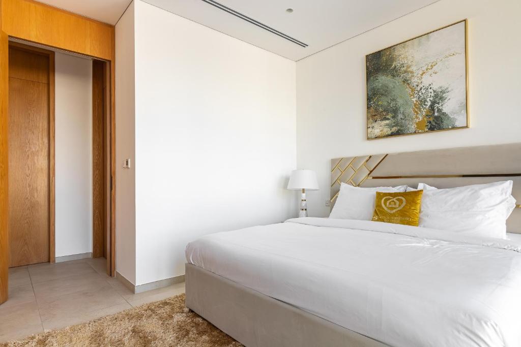 Postel nebo postele na pokoji v ubytování Modern 1Br in the Heart of Dubai by SIMPLY COMFORT