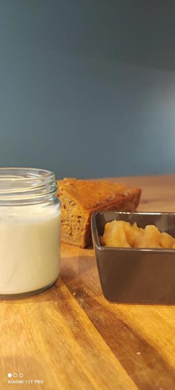 a table with a container of butter and some bread at Château Vieux Clos Saint Émilion in Saint-Émilion