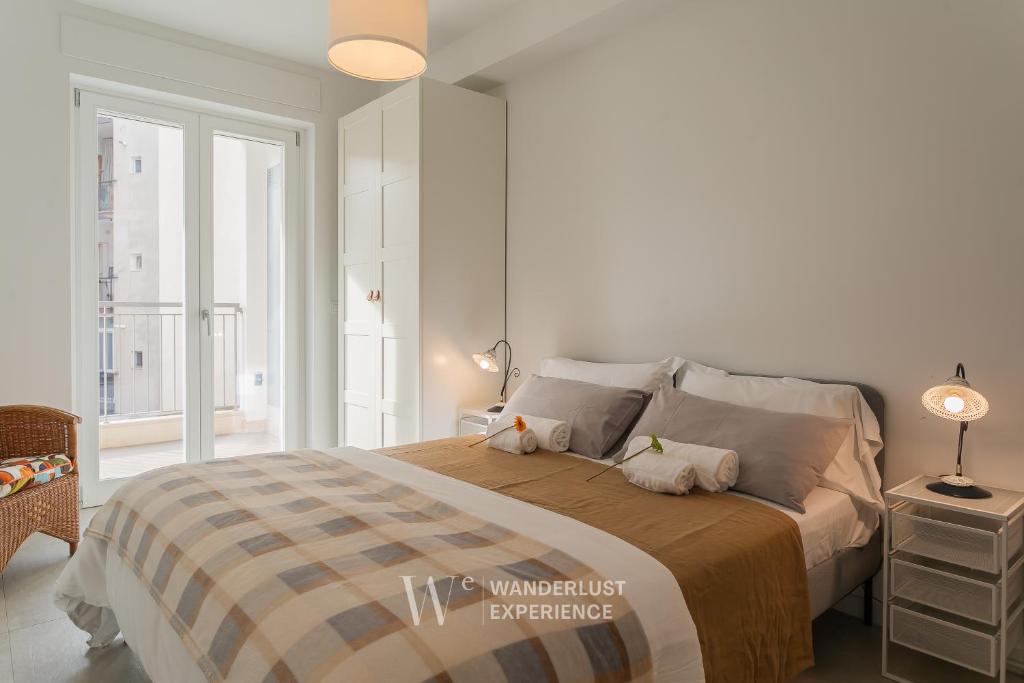 Postel nebo postele na pokoji v ubytování Wanderlust Experience Pumetta Apartment