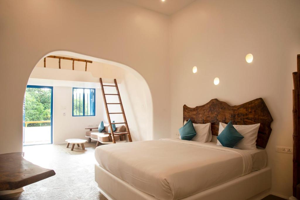 Postel nebo postele na pokoji v ubytování Conch Resort Luxury Private Pool Suites