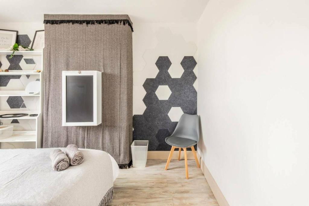 Ένα ή περισσότερα κρεβάτια σε δωμάτιο στο Bright & Stylish 4-Bed Home in the Heart of Morden