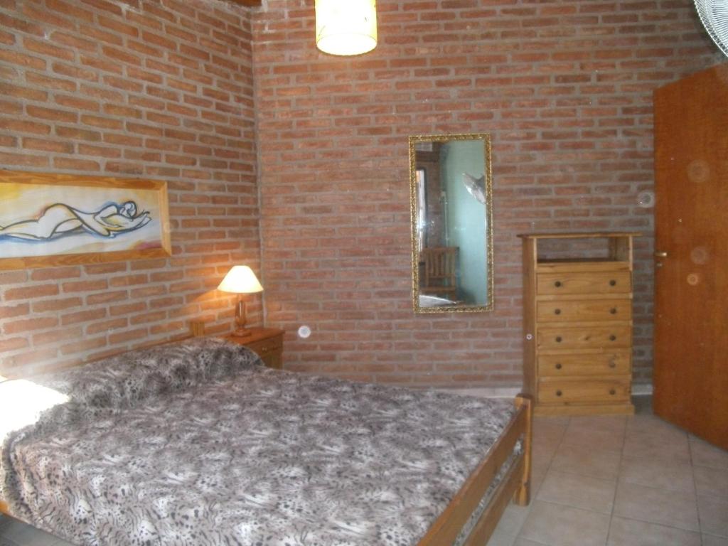 Voodi või voodid majutusasutuse Cabañas Tio Willy toas