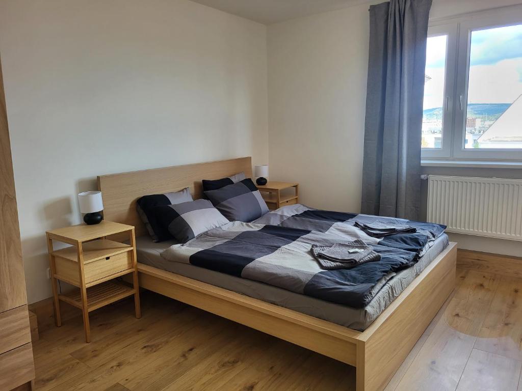 Postel nebo postele na pokoji v ubytování City Center Apartments - Moderna Brno Římské náměstí V
