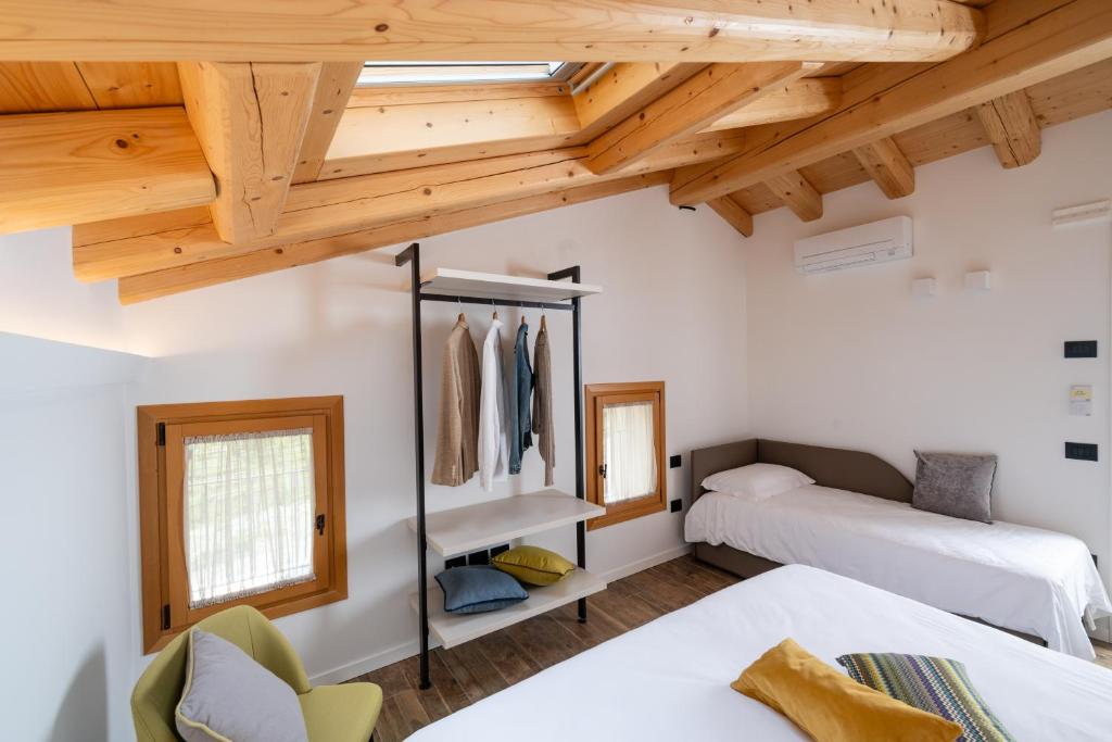 Postel nebo postele na pokoji v ubytování Borgo Paolin - Camere in vigna
