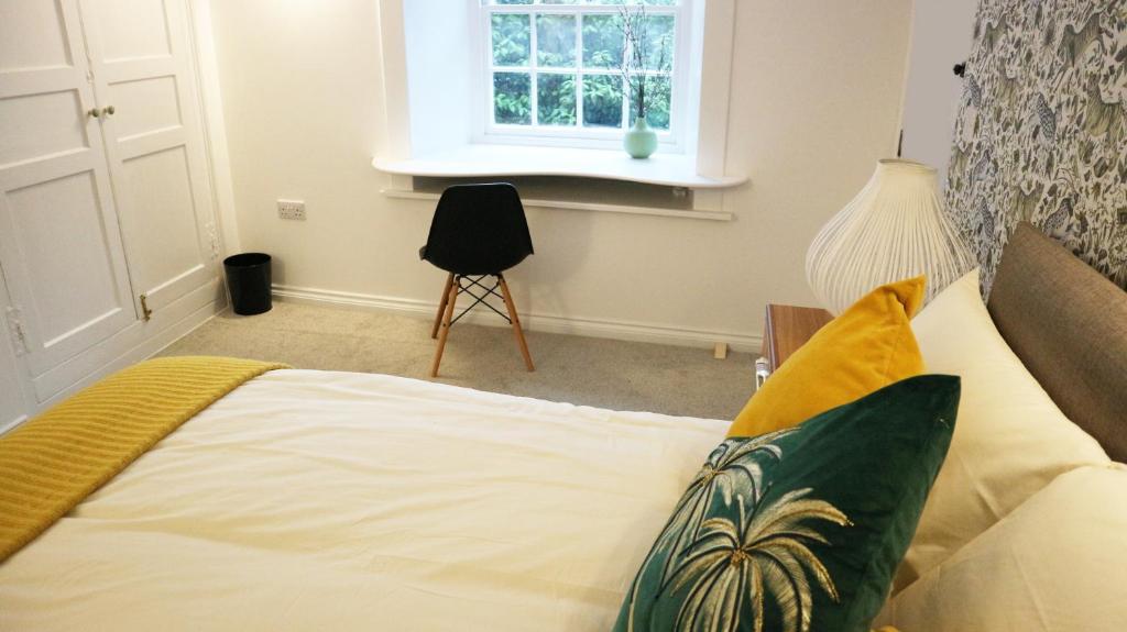 Postel nebo postele na pokoji v ubytování Peterborough House
