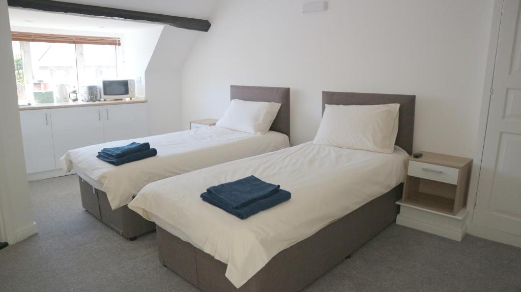 Postel nebo postele na pokoji v ubytování Peterborough House