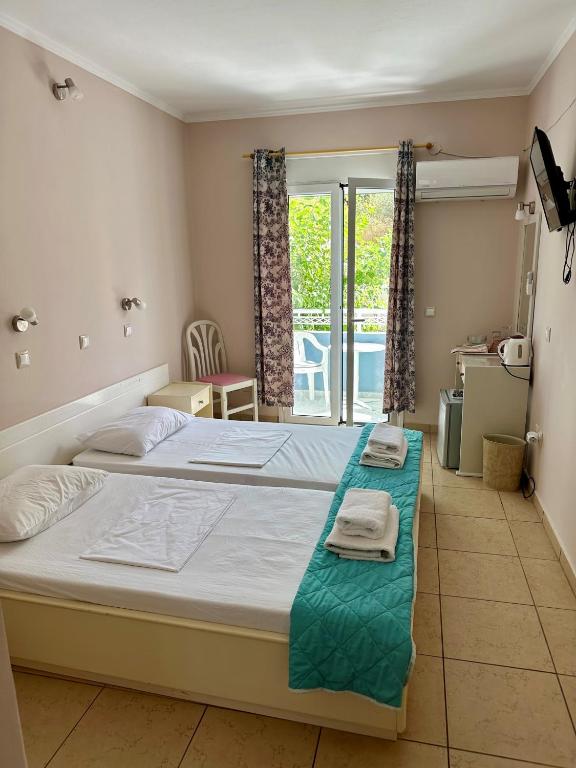 Postel nebo postele na pokoji v ubytování Hotel Lenox