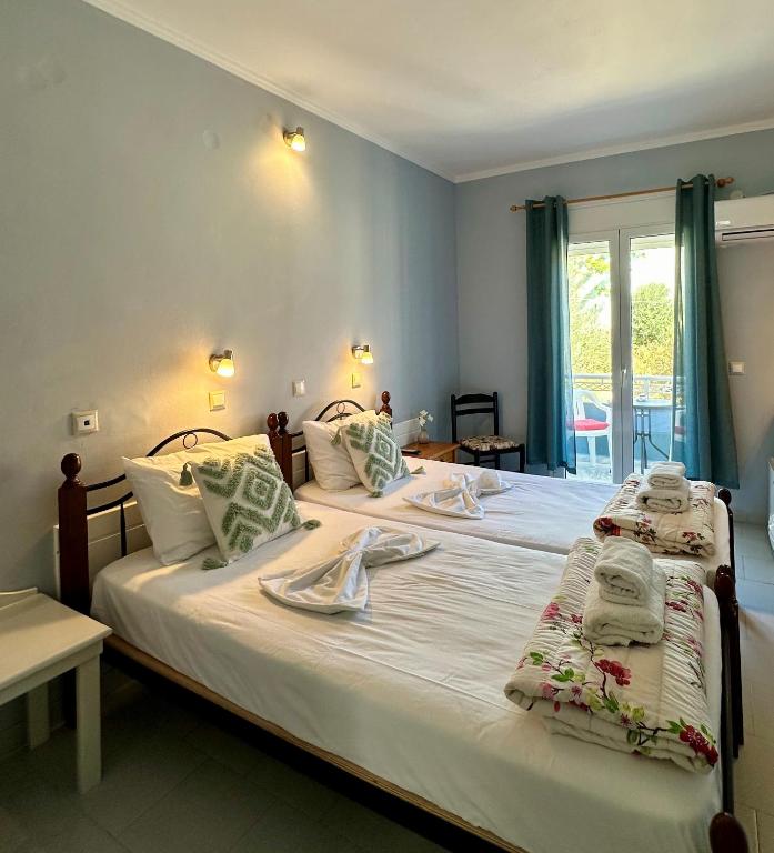 Postel nebo postele na pokoji v ubytování Hotel Lenox
