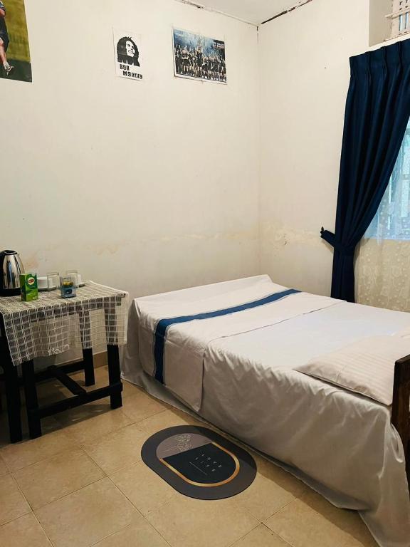 Postel nebo postele na pokoji v ubytování Meeyan Ella Rest