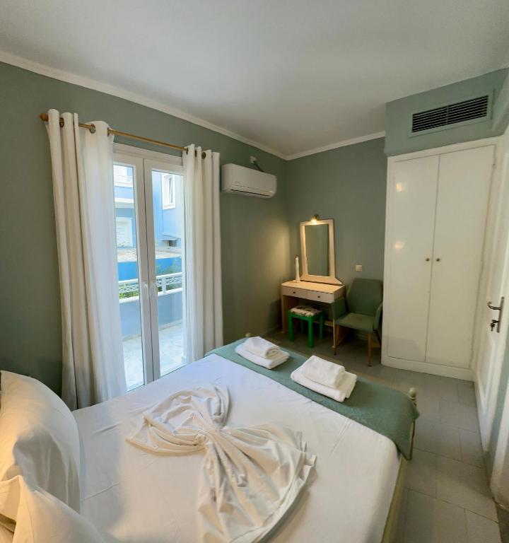 Postel nebo postele na pokoji v ubytování Hotel Lenox