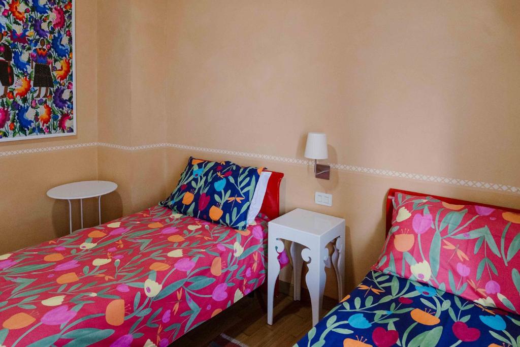 Postel nebo postele na pokoji v ubytování B&B La Casa Di Tocco