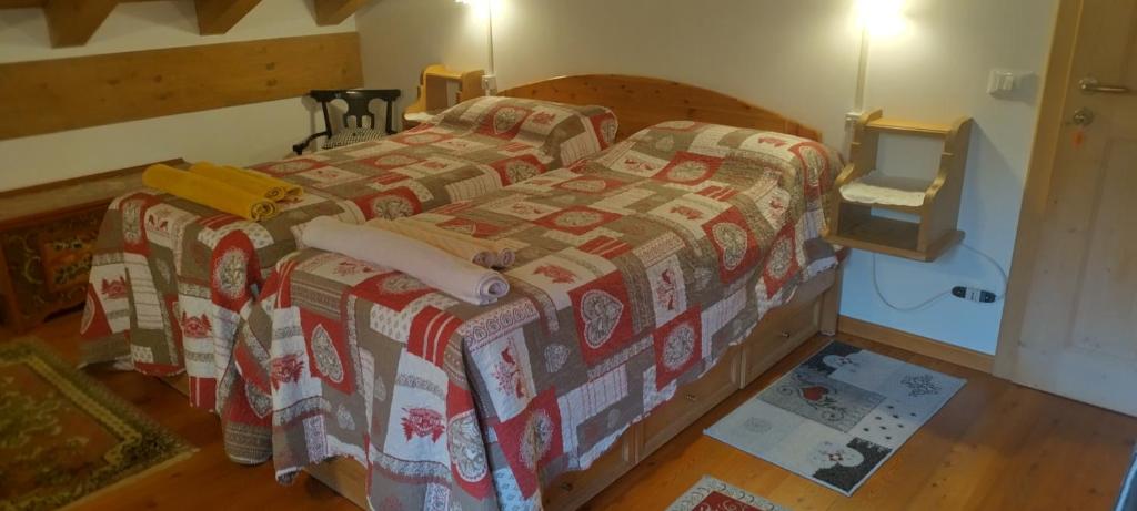 Postel nebo postele na pokoji v ubytování B&B Dolomiti
