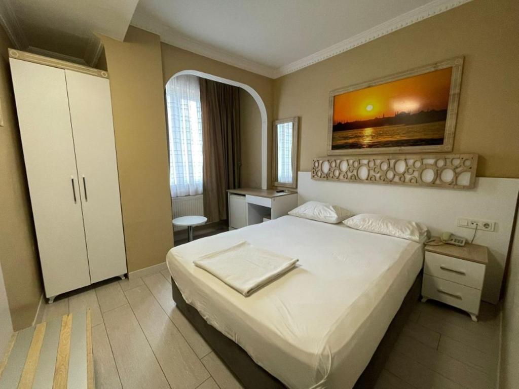 Postel nebo postele na pokoji v ubytování GRAND VATAN HOTEL