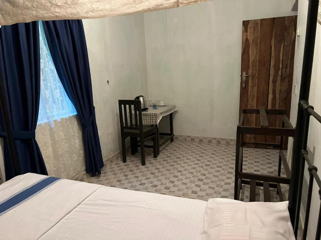 Postel nebo postele na pokoji v ubytování Meeyan Ella Rest