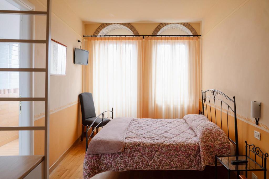Postel nebo postele na pokoji v ubytování B&B La Casa Di Tocco