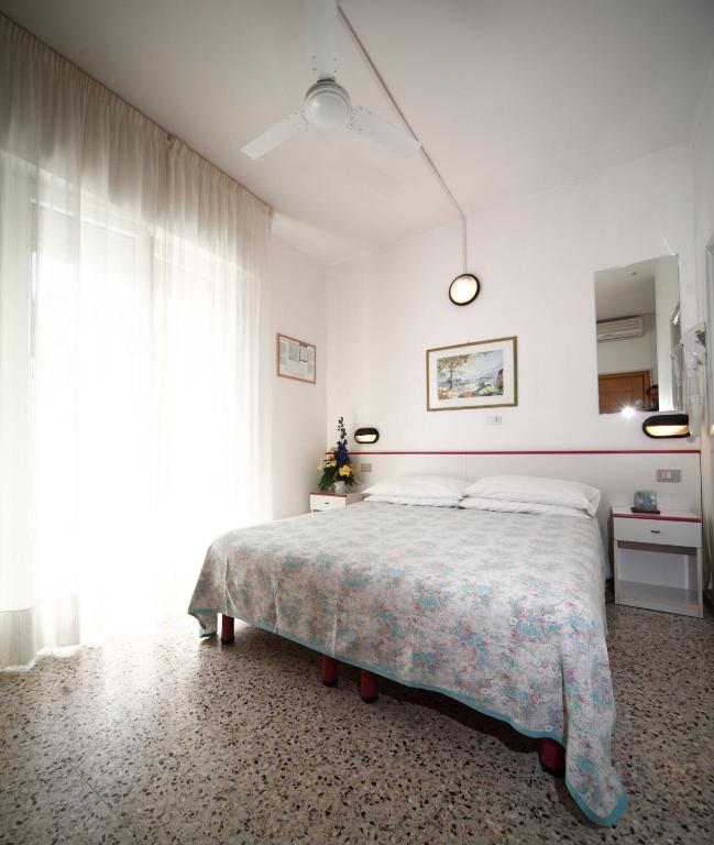 Postel nebo postele na pokoji v ubytování Hotel Lara