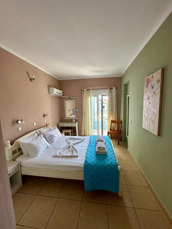Postel nebo postele na pokoji v ubytování Hotel Lenox