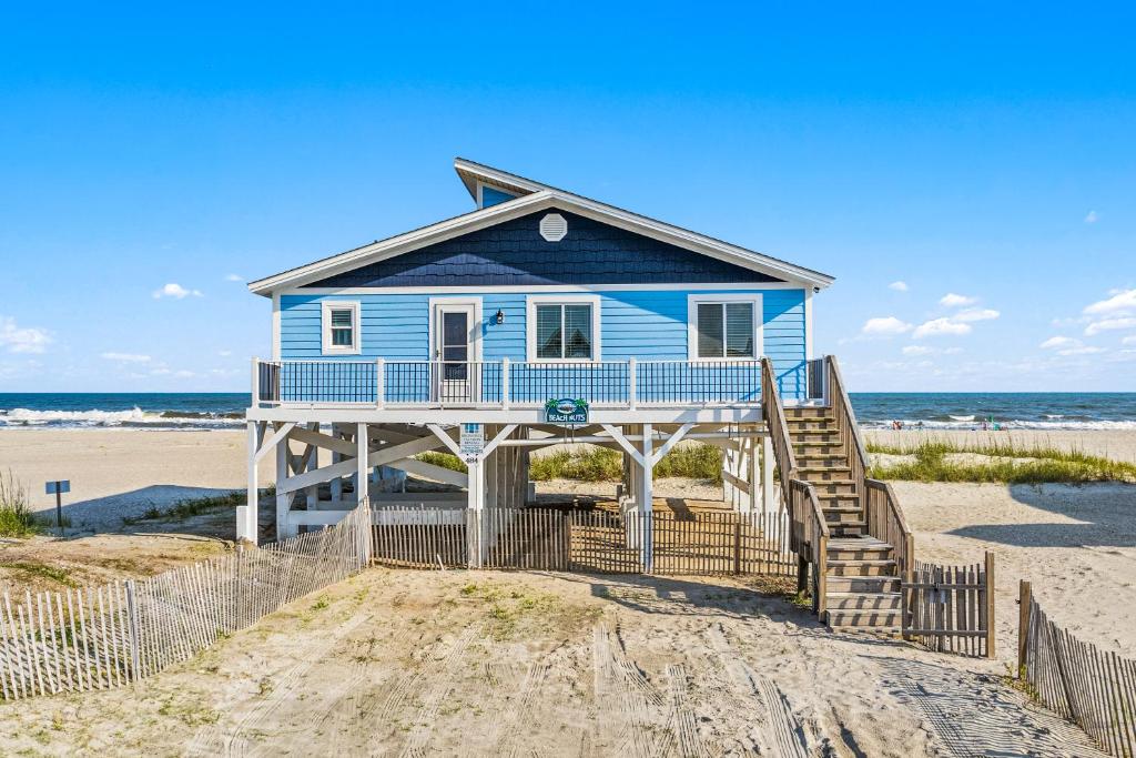 a blue house on the beach at Ocean Front, Pet Friendly with AMAZING Views in Ocean Isle Beach in Ocean Isle Beach