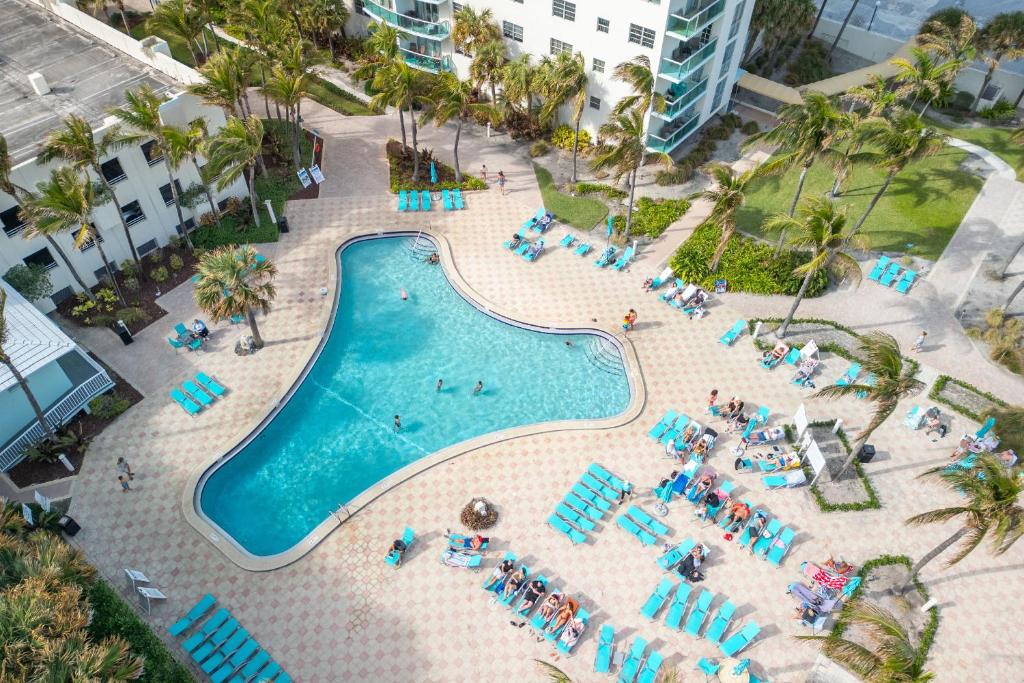 an overhead view of a swimming pool in a resort at Oceanview King Bed Right on the Beach w Pool&Gym in Hollywood