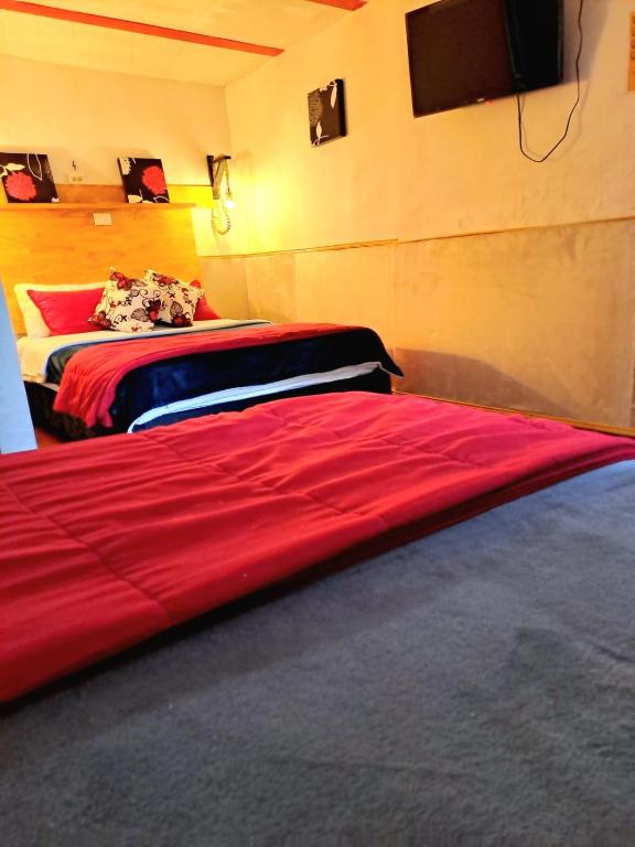 Postel nebo postele na pokoji v ubytování Hotel Marrokos Aeropuerto José María Córdova