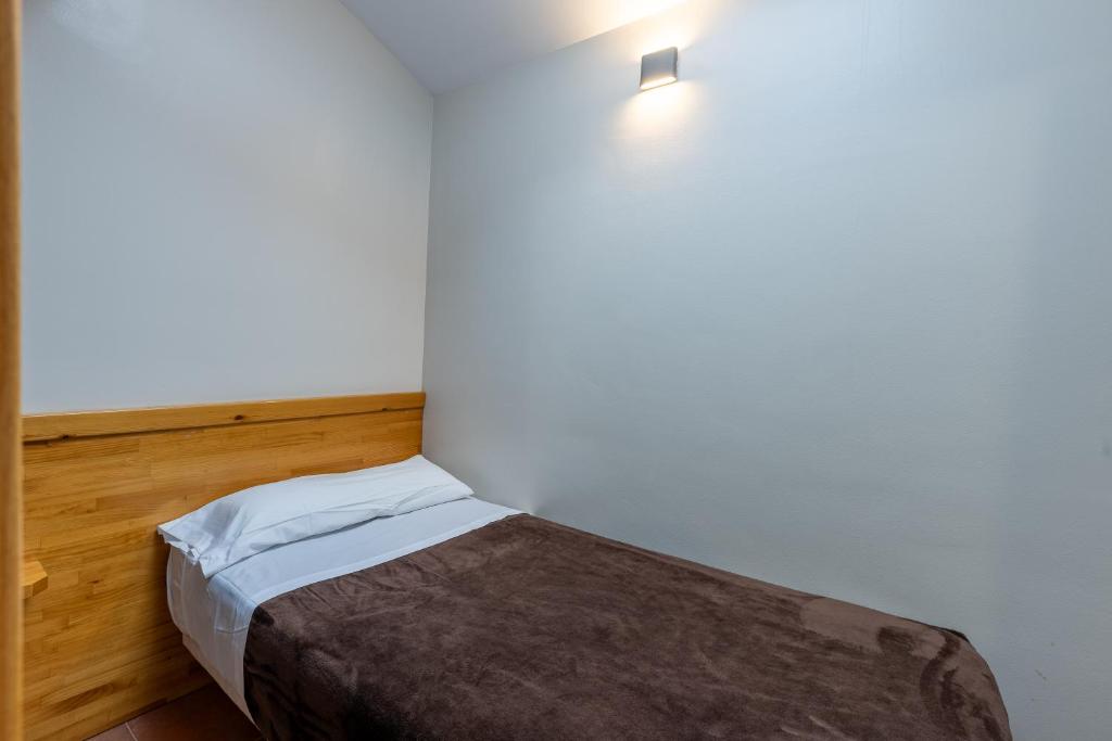 Postel nebo postele na pokoji v ubytování Apartaments Sant Moritz