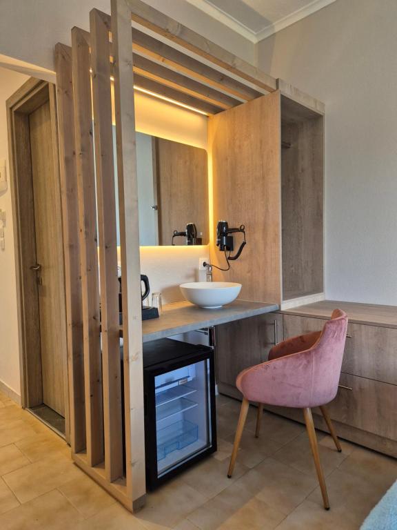Kuchyň nebo kuchyňský kout v ubytování Morfeas Hotel