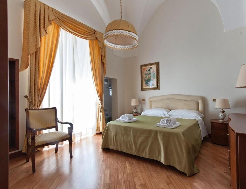 A bed or beds in a room at Dimora Corte Lubelli
