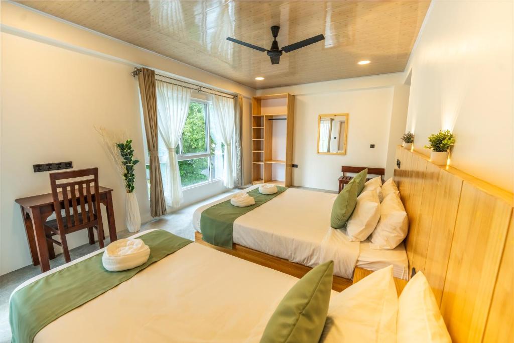 Postel nebo postele na pokoji v ubytování Blissview Maldives - Thulusdhoo
