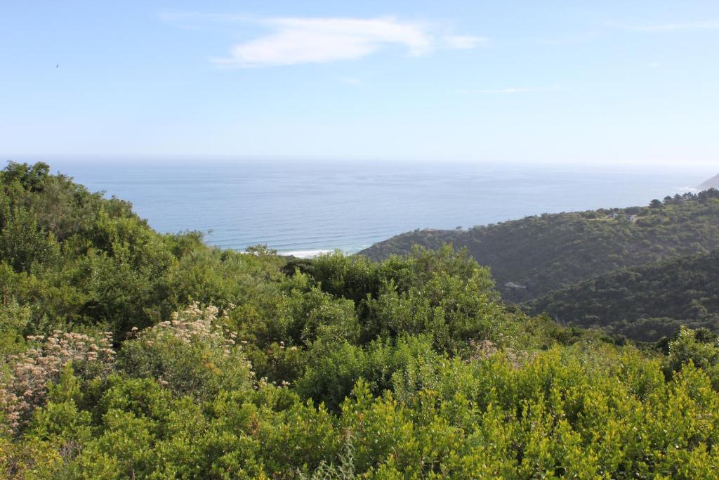 a view of the ocean from the top of a hill at WILDERNESS SEASIDE ESCAPE in Wilderness