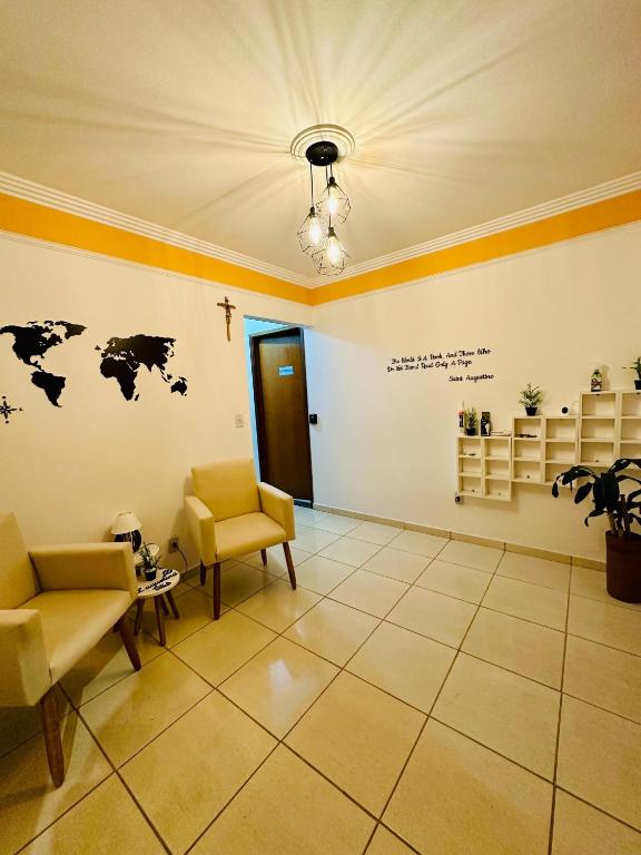 a living room with a couch and chairs in a room at LAquolina in Socorro