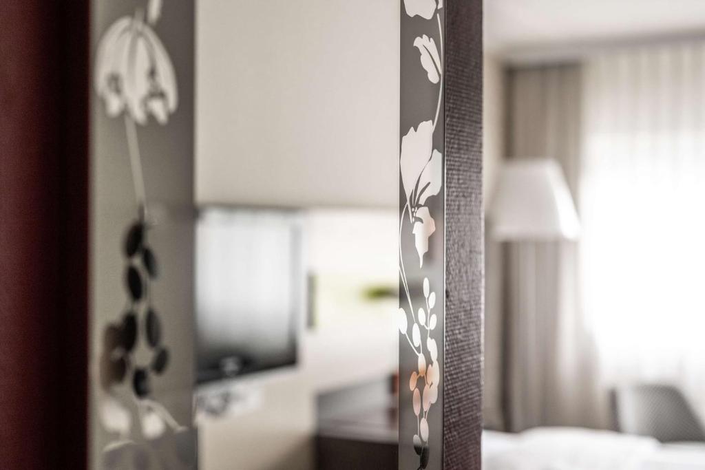 Postel nebo postele na pokoji v ubytování pentahotel Kassel