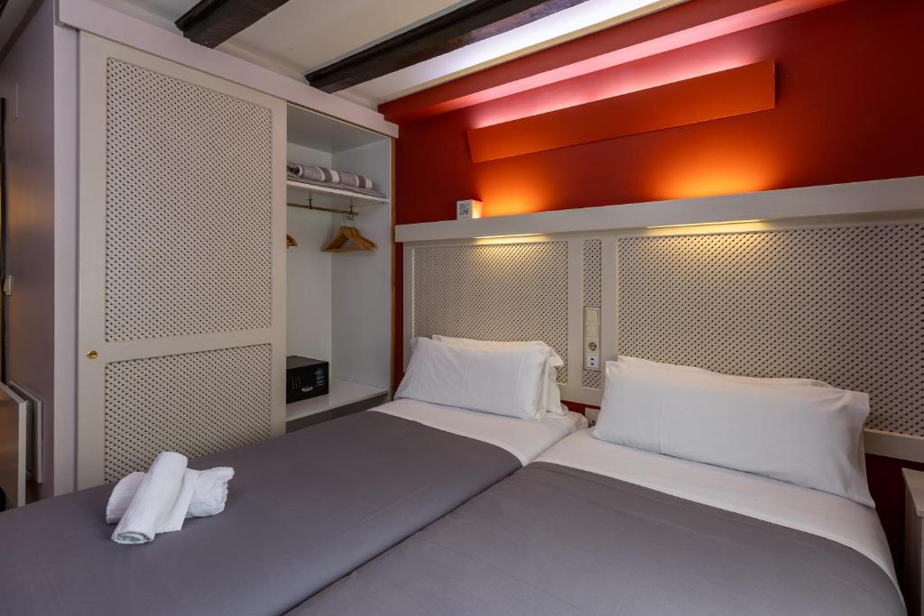 Postel nebo postele na pokoji v ubytování Hotel Micolau