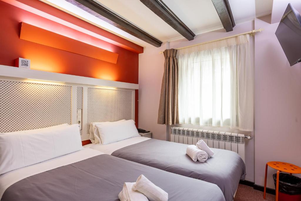Postel nebo postele na pokoji v ubytování Hotel Micolau