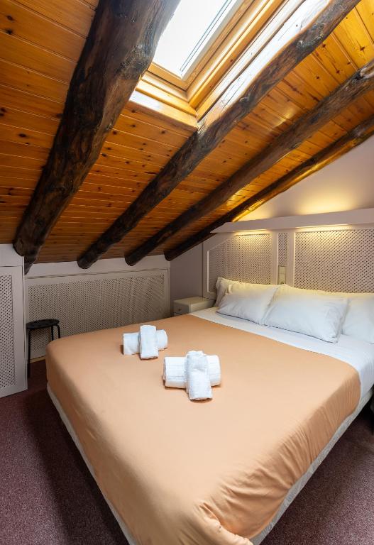 Postel nebo postele na pokoji v ubytování Hotel Micolau